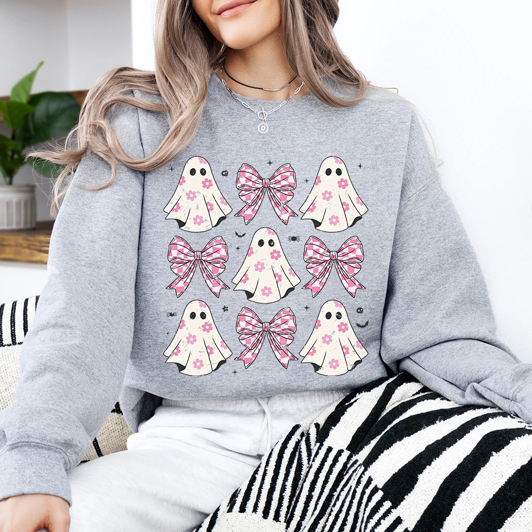 gray sweatshirt with pink ghost and bow designs