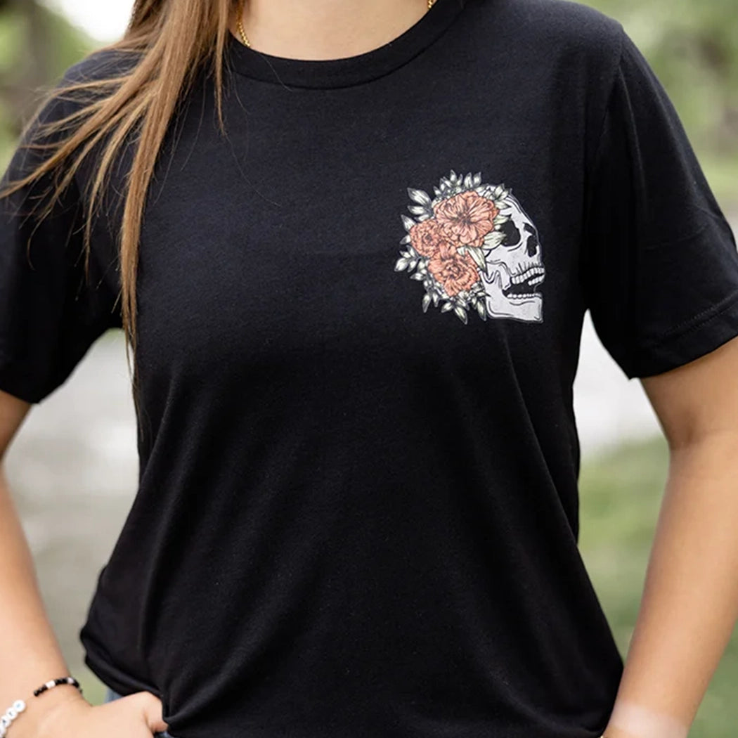 Black tshirt with light gray skeleton with flowers on front. Back of tee has gray skeleton with pink flowers in the middle and the words Be Fearlessly Authentic around it.