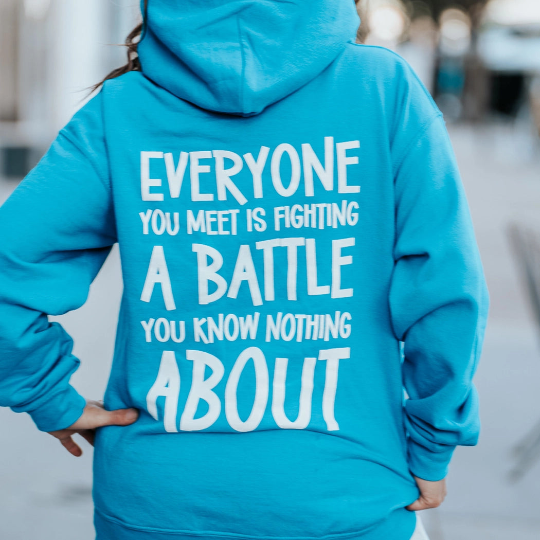 Be Kind blue hoodie. Back of hoodie. Everyone you meet is fighting a battle you know nothing about.