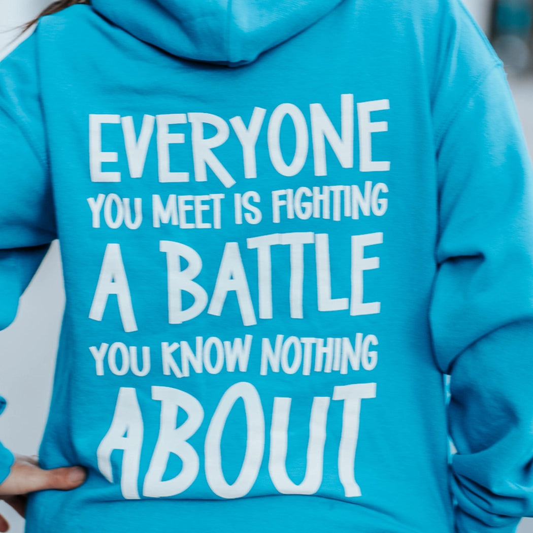 Be Kind blue hoodie. Back of hoodie. Everyone you meet is fighting a battle you know nothing about.