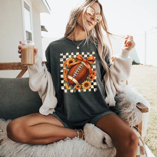 Football-themed graphic t-shirt with a checkered pattern and sunflowers.