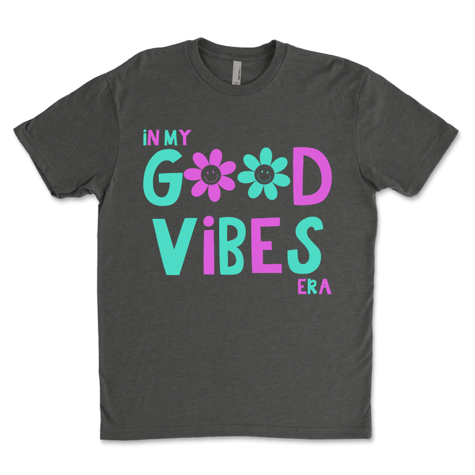 In my good vibe area gray t-shirt.  Blue and pink design with flower smiley face. 