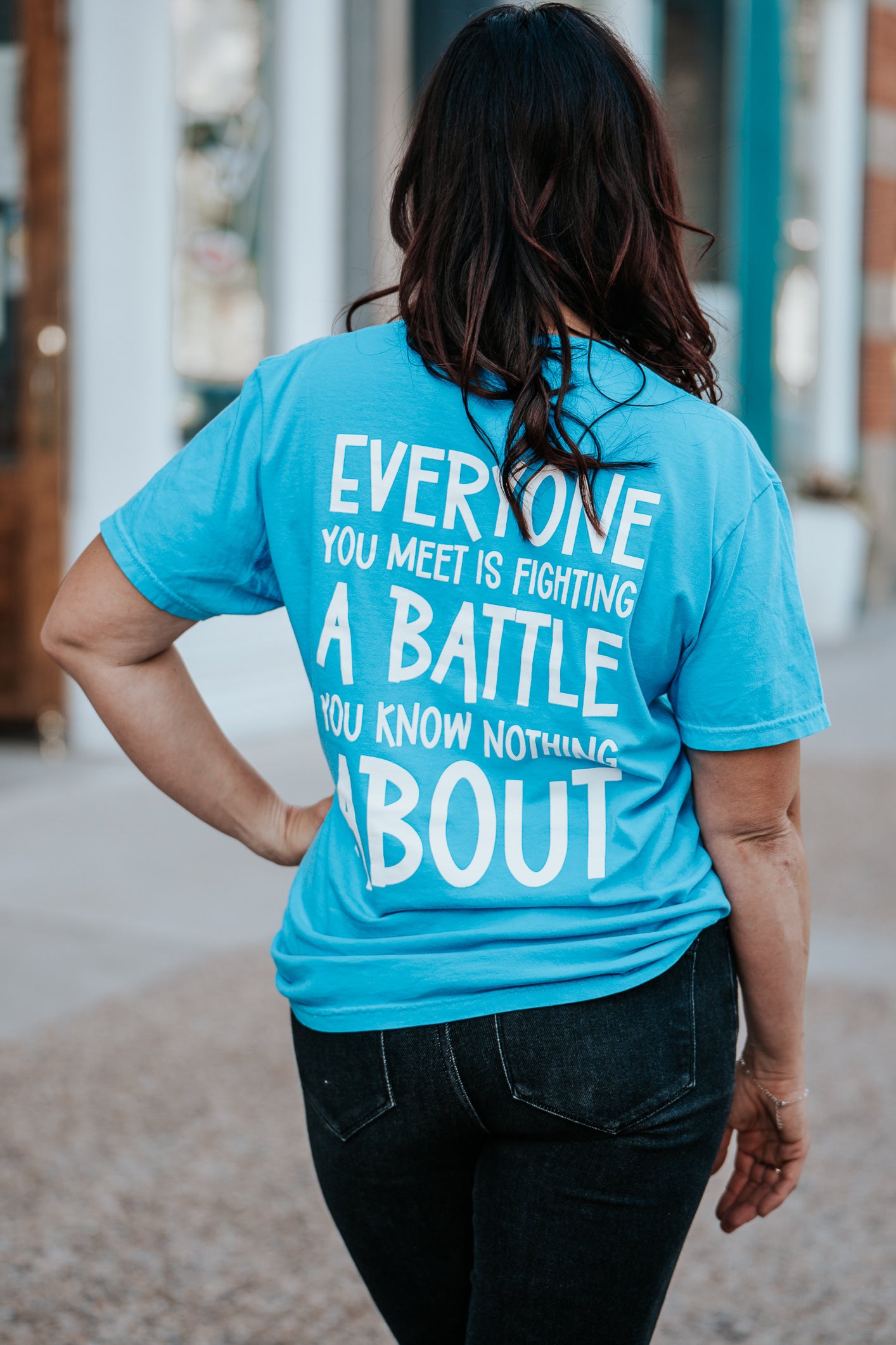 Be Kind blue tshirt back of shirt. Everyone you meet is fighting a battle you know nothing about.