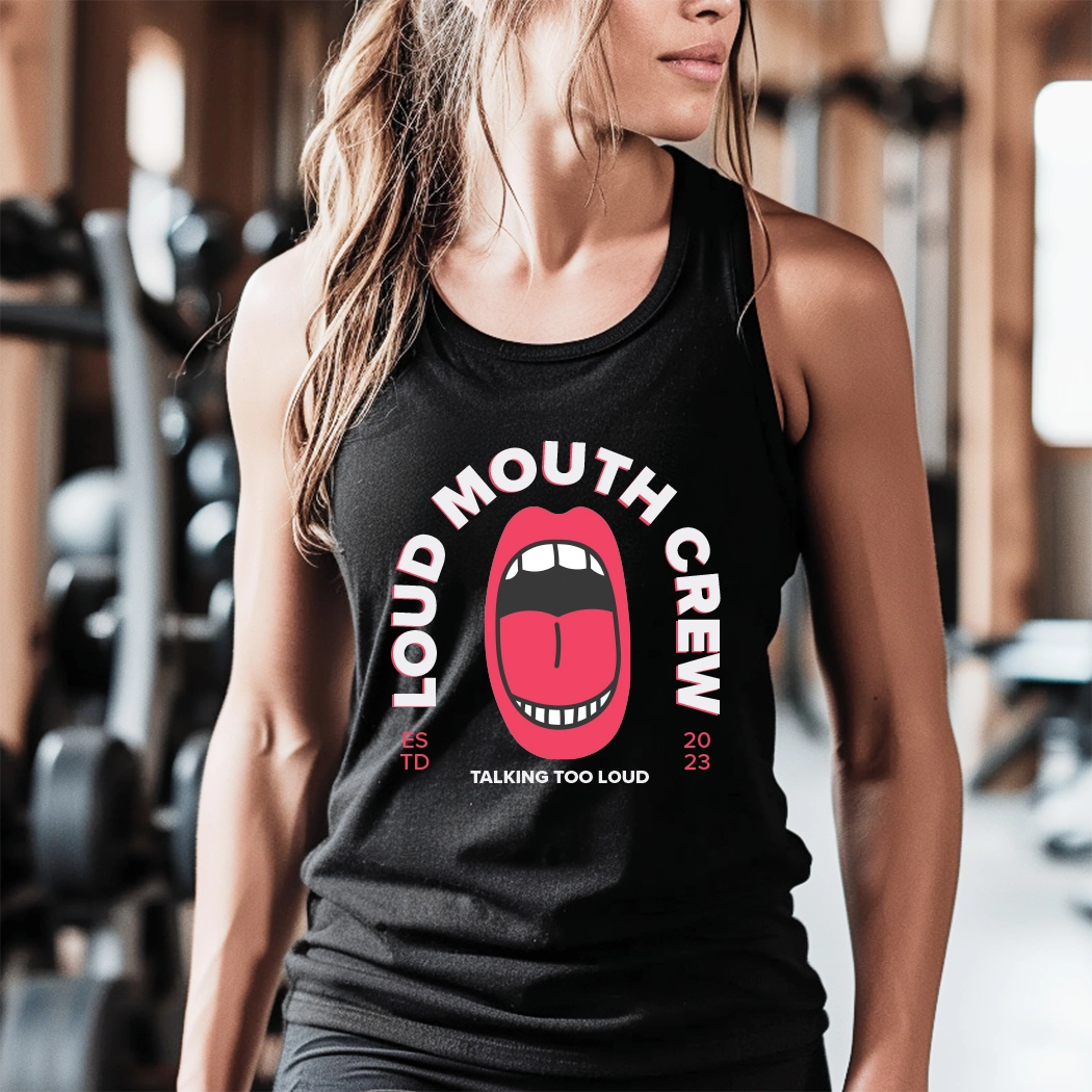 The workout tank has the text "Loud Mouth Crew" printed on it. The text is in a large, bold font and is centered on the tank. The tank is a light gray color and appears to be made of a soft, breathable fabric. It has a racerback style, which is designed to provide a full range of motion for the wearer. The tank is also moisture-wicking, which helps to keep the wearer cool and dry during exercise.