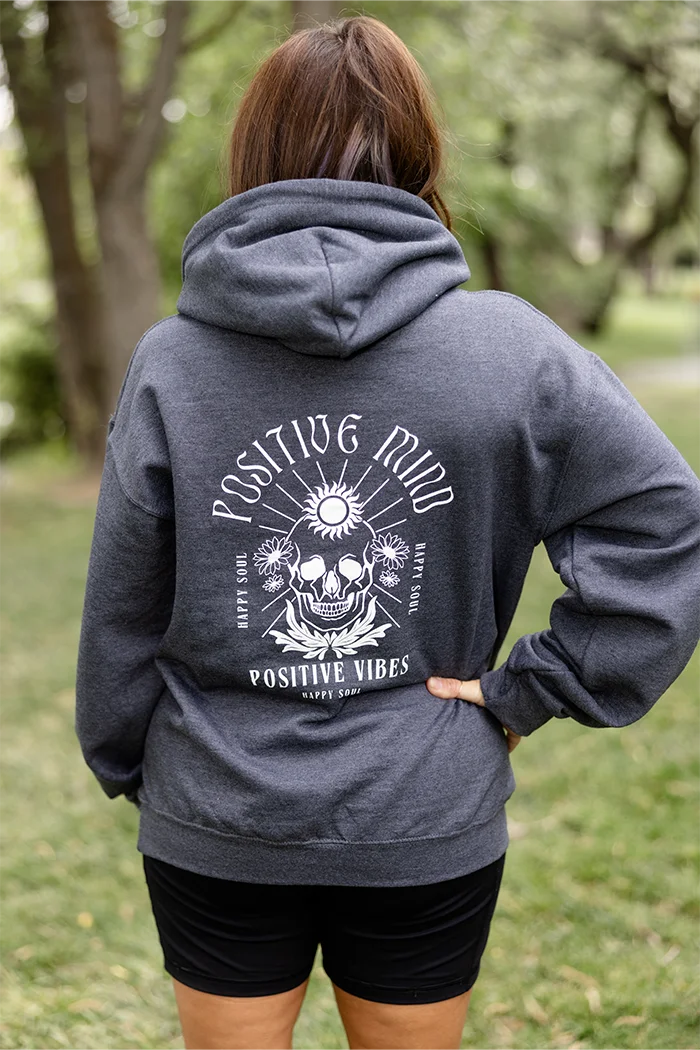 Gray pull over hoodie with white graphic that says positive mind, happy soul and positive vibes.