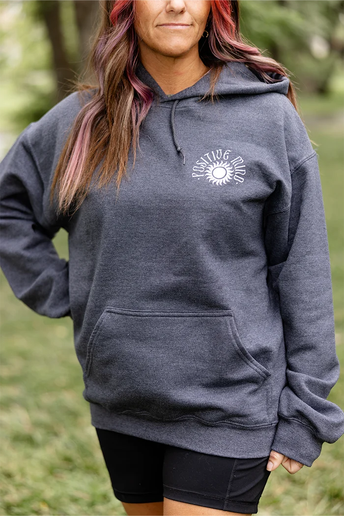 Gray pull over hoodie with white graphic that says positive mind, happy soul and positive vibes.