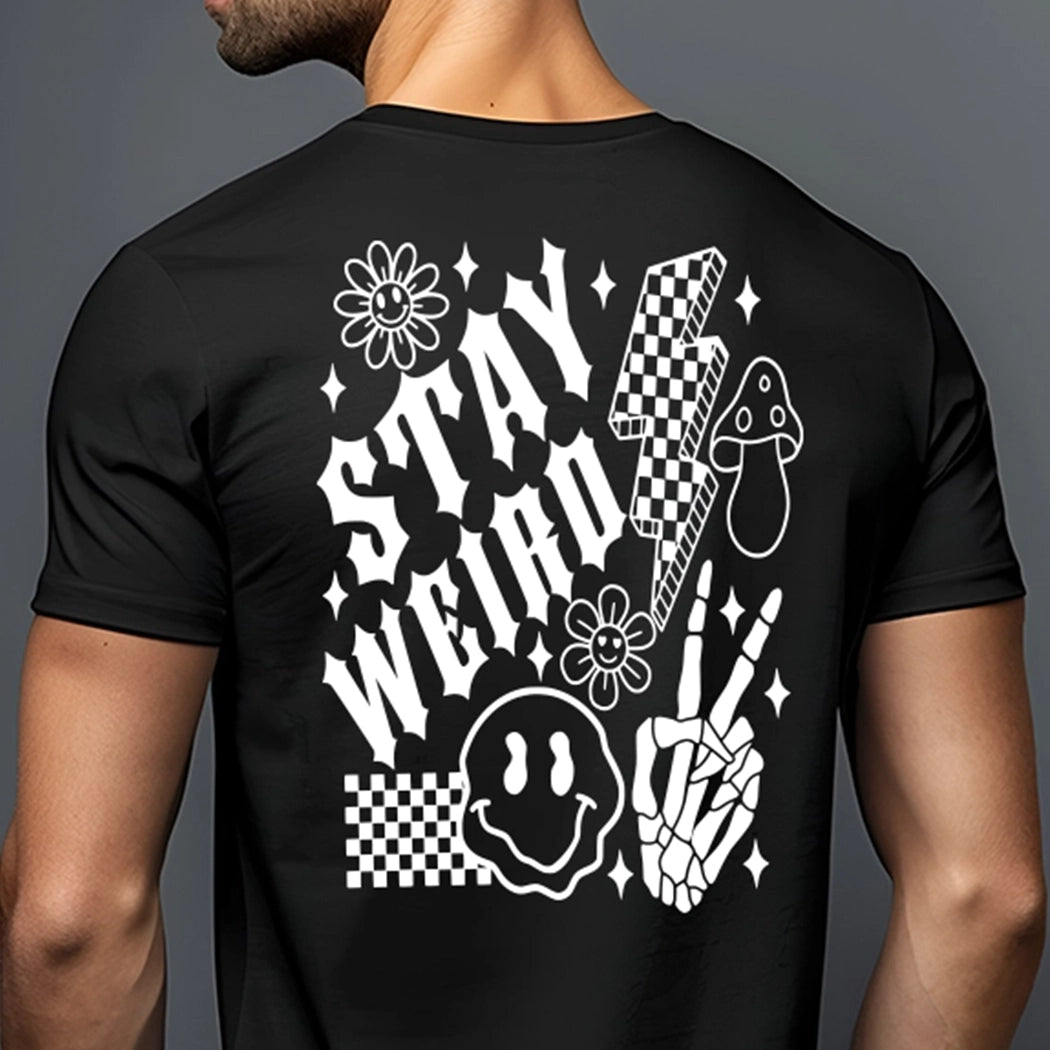 Black shirt with white design. Checkered design with droopy smile face, lightning bulb, mushroom, flowers and skeleton fingers. Shirt says stay weird. 