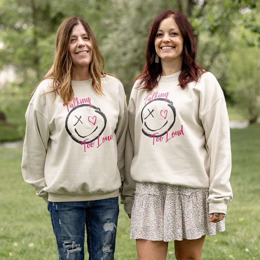 Woman wearning talking too loud crewneck in tan