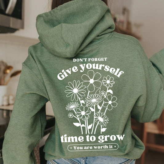 Don't forget give yourself time to grow. You are worth it. Positive message shirt. Black design on a green hoodie. Gildan hoodie. You are worth it with flower on front.