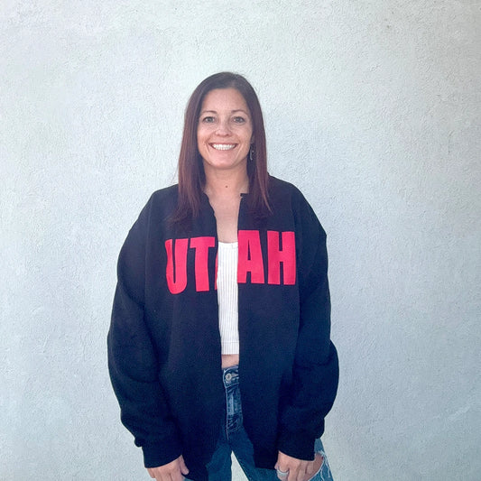black cut or spilt crewneck with 'UTAH' printed in red