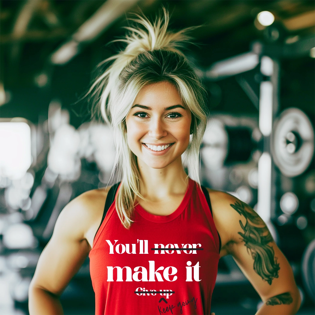 The workout graphic apparel tank has the text "You'll Make It. Keep Going. " printed on it. The text is in a large, bold font and is centered on the tank. The tank is a light gray color and appears to be made of a soft, breathable fabric. It has a racerback style, which is designed to provide a full range of motion for the wearer. The tank is also moisture-wicking, which helps to keep the wearer cool and dry during exercise.